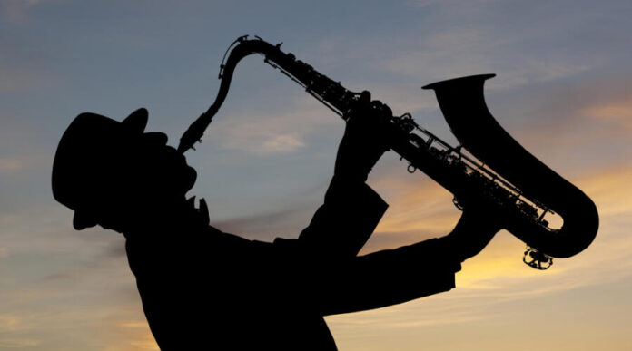 Saxophonist.,Man,Playing,On,Saxophone,Against,The,Background,Of,Sunset