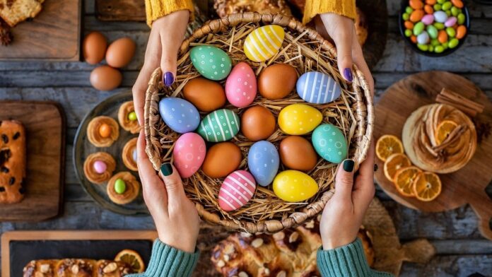 Hands,Of,Two,Women,With,Easter,Buns,And,Easter,Eggs.