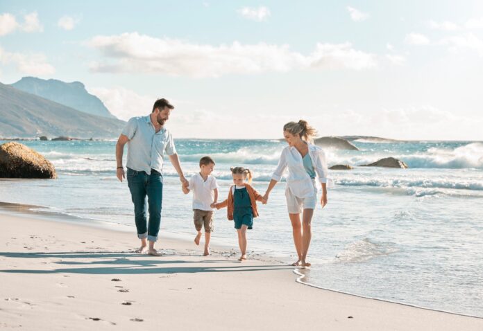 Parents,,Children,And,Holding,Hands,For,Vacation,At,Beach,With