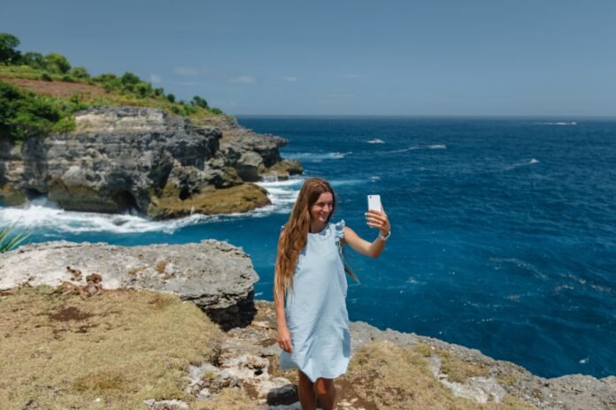 Young,And,Happy,Tourist,Woman,Smiling,Taking,Selfie,Portrait,With